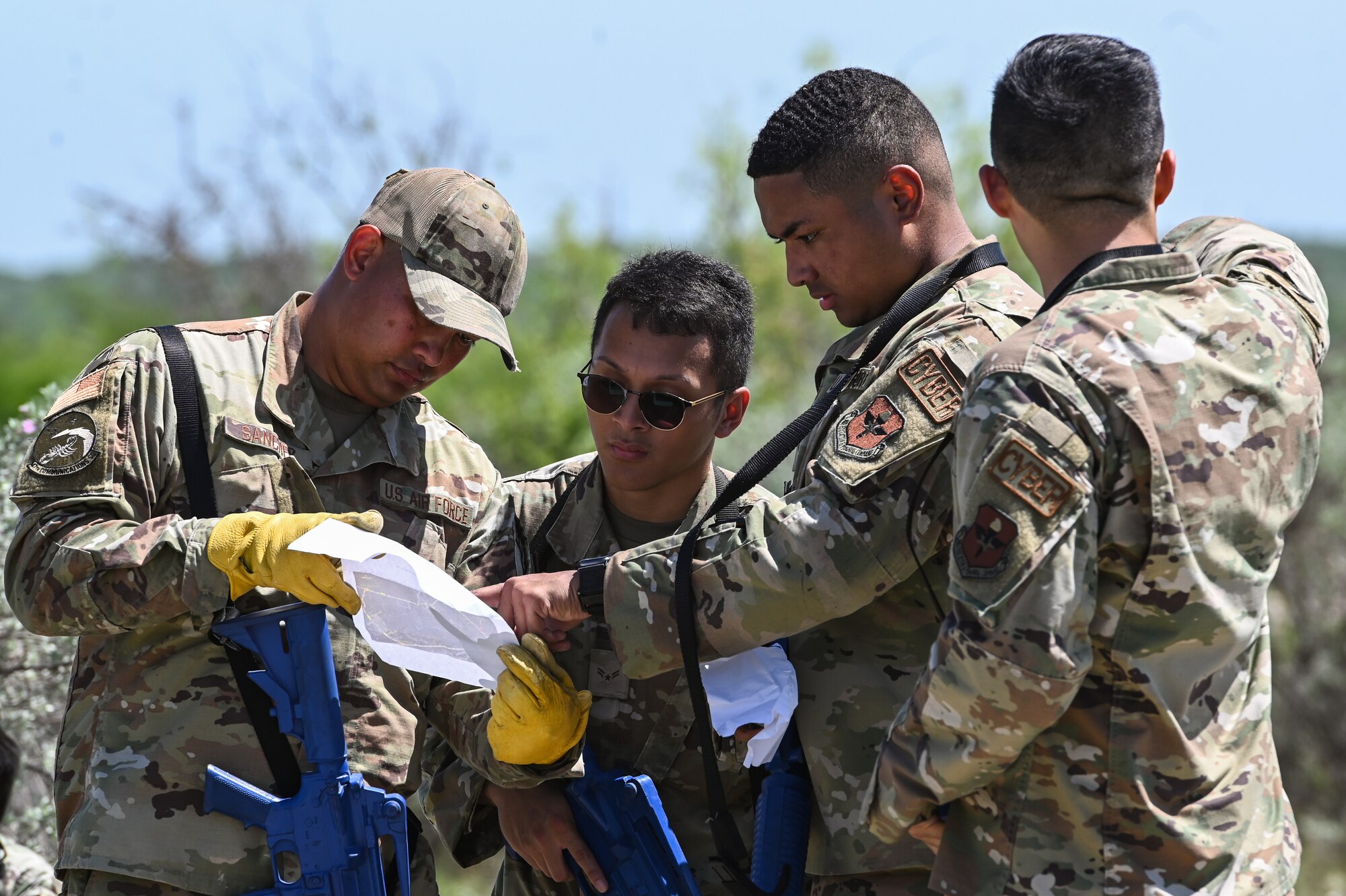 U.S. Air Force Airmen from the 47th Mission Support Group look over a map of the surrounding area during a training exercise at Laughlin Air Force Base, Texas, on April 28, 2023