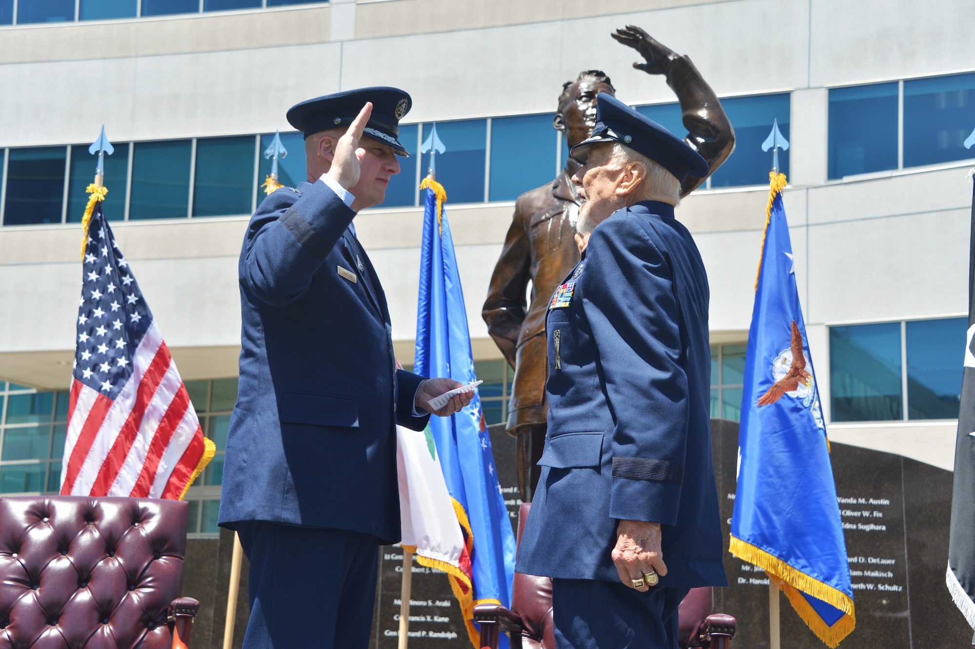 Space Force Lt. Gen. Michael Guetlein, Space Systems Commander (left) reaffirms oath to retired Air Force Brig. Gen. Buzz Aldrin (right) during his promotion ceremony at Space Systems Command on May 5, 2023. Aldrin flew the F-86 Sabre in 66 combat missions, where he shot down two MIG-15s, while assigned to Suwon Air Base South Korea’s 16th Fighter-Interceptor Squadron and served as a flight commander within the 22nd Fighter Squadron at Bitburg Air Base Germany. (U.S. Space Force photo by Van Ha)