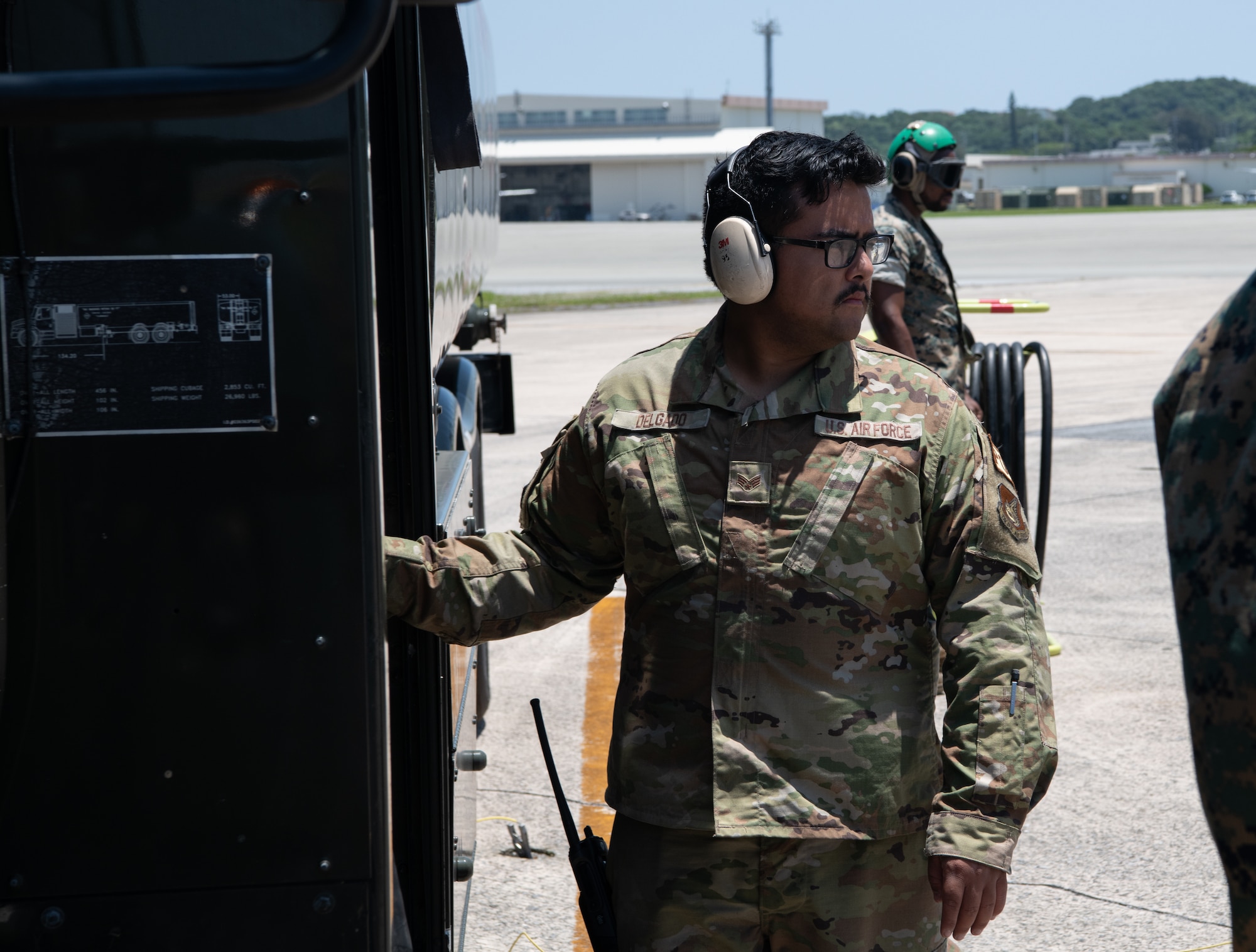 An Airman monitors fuel gauges.