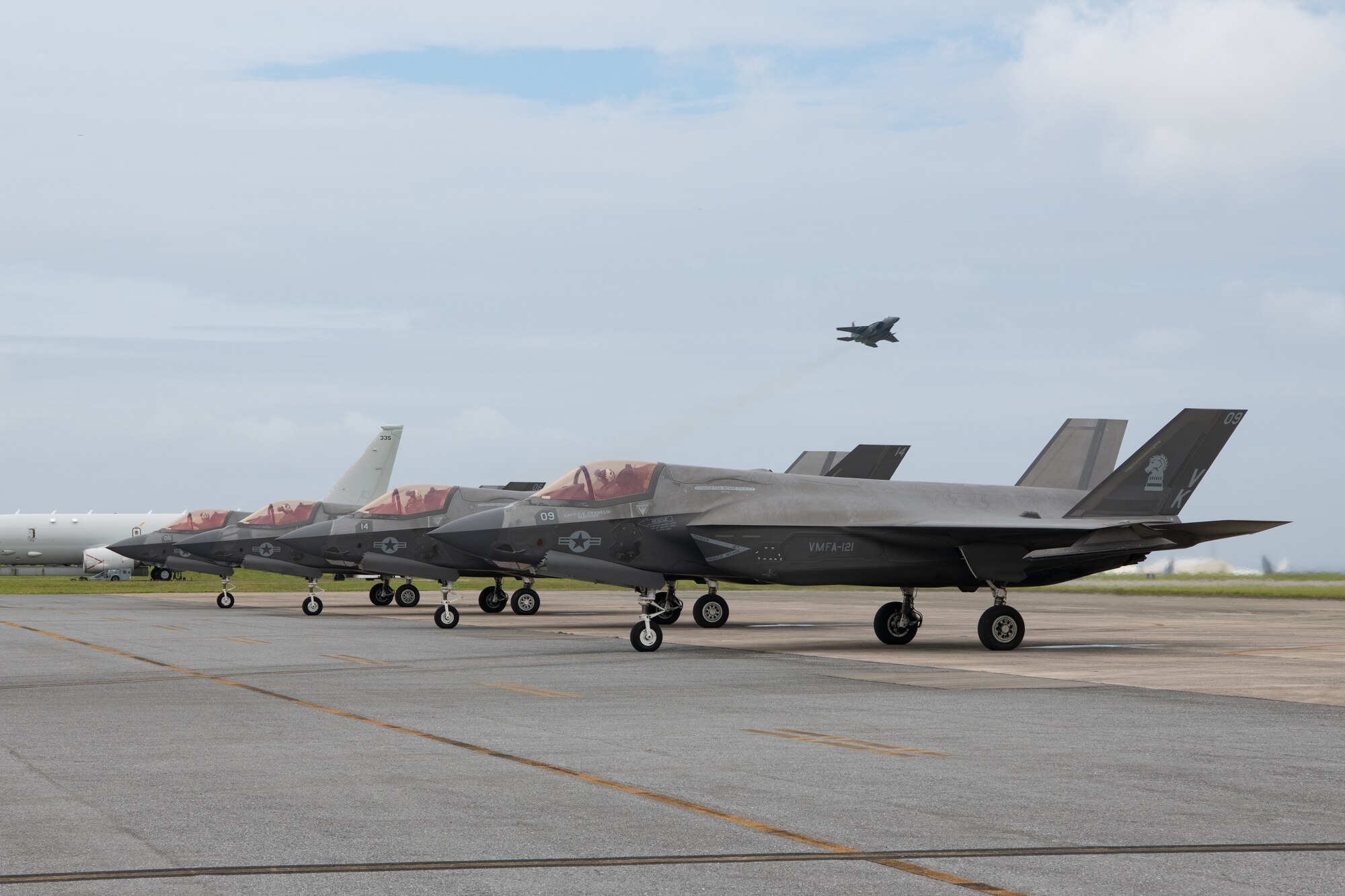 Aircraft sit on a flightline.
