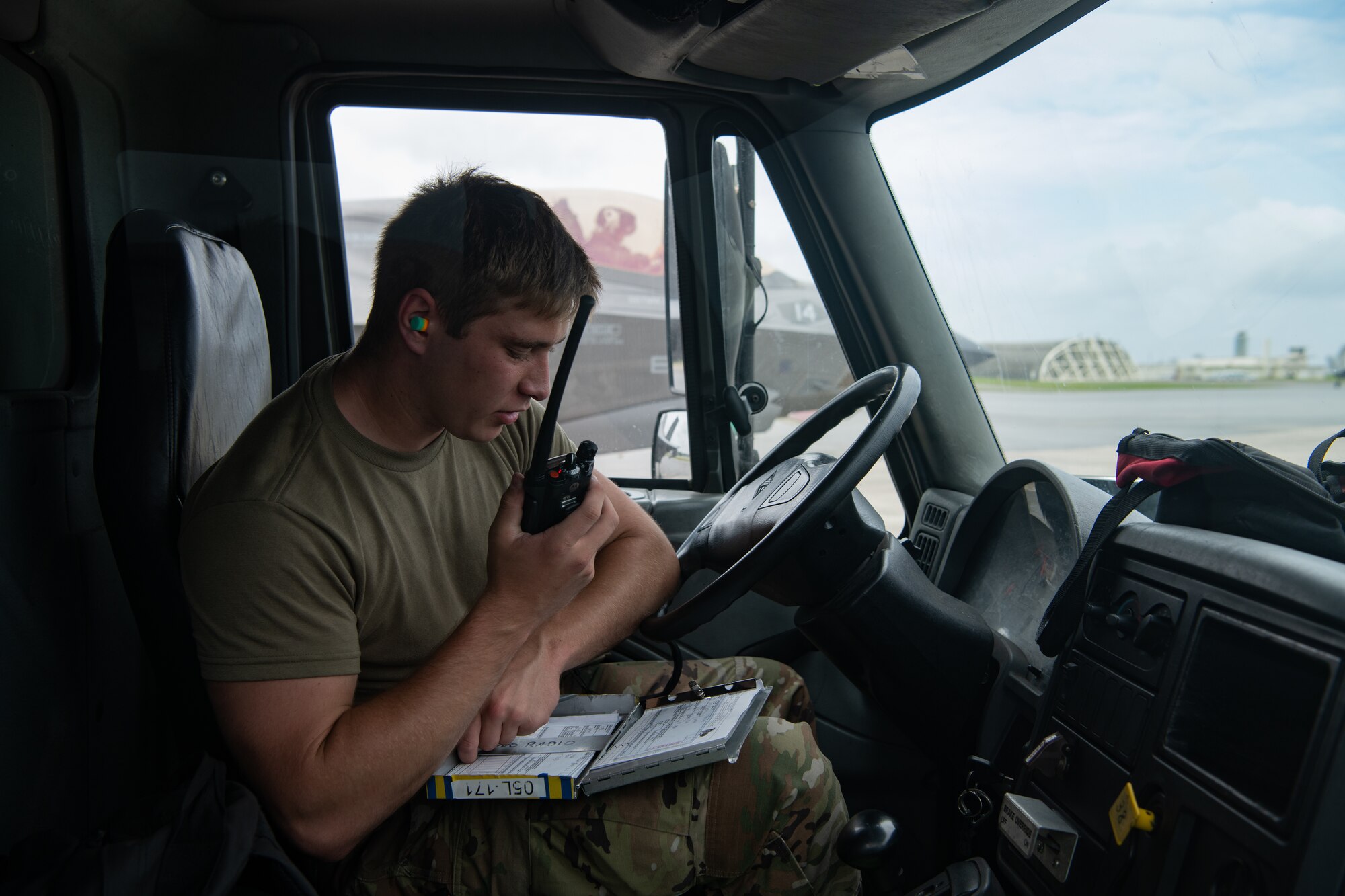An Airman speaks on the radio.