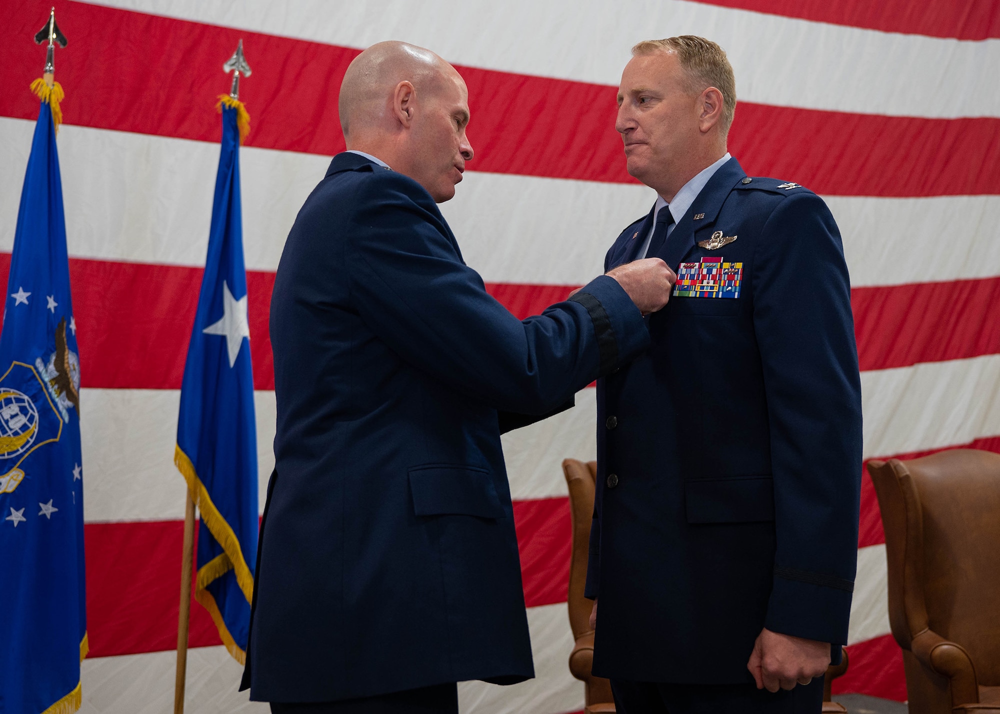 Air Force major general pins award to colonel