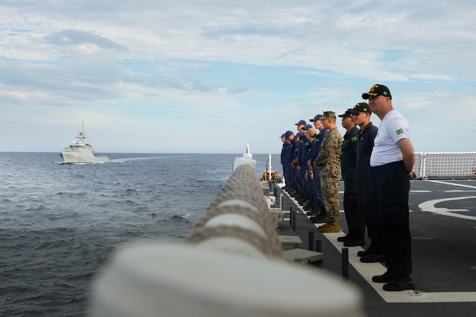 Crew members from the USCGC Stone (WMSL 758) and the Brazil Navy ship Amazonas render honors to Amazonas during combined training exercises in the Southern Atlantic Ocean, March 6, 2023. Stone recently completed a multi-mission deployment in the South Atlantic Ocean to counter illicit maritime activities and strengthen relationships for maritime sovereignty throughout the region.