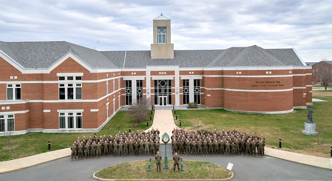 U.S. Marines with Marine Innovation Unit, U.S. Marine Corps Forces Reserve, pose for a photo following an annual training period on Marine Corps Base Quantico, Virginia, March 11, 2023. U.S. Marines and Sailors with the Marine Innovation Unit (MIU), U.S. Marine Corps Forces Reserve, held Annual Training 2023 to prepare to support their clients across the Total Force; make headway on internal and external engagements; test the Talent Marketplace; and assess MIU's systems for internal coordination and support. MIU leverages existing Marine talent in order to: accelerate the adoption of advanced capabilities; transform Naval Service capacity for technology employment; and retain and invest in Total Force human capital. (U.S. Marine Corps photo by 1st Lt. Kevin P. Stapleton)