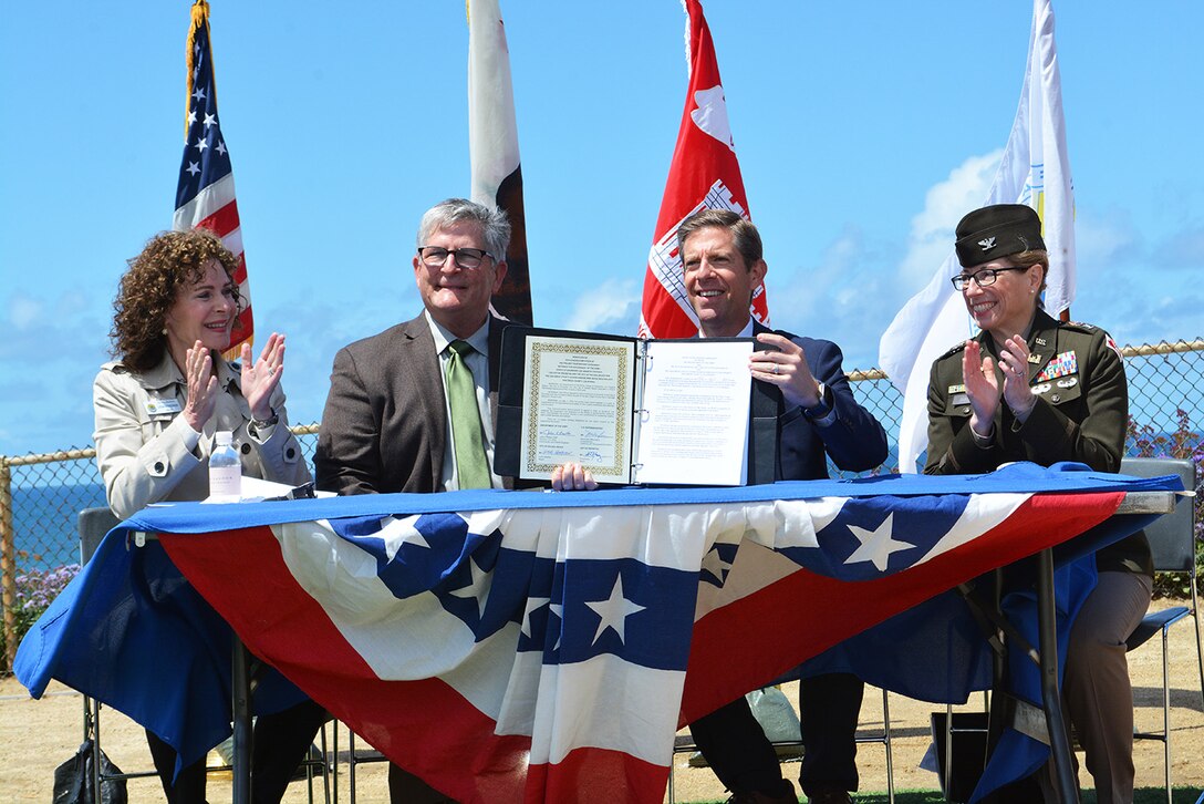 From left to right: Lesa Heebner, mayor of Solana Beach; Tony Kranz, mayor of Encinitas; U.S. Congressman Mike Levin, 49th Congressional District, California; and Col. Julie Balten, commander of the U.S. Army Corps of Engineers Los Angeles District, celebrate after signing a ceremonial Project Partnership Agreement for the San Diego County (Encinitas and Solana Beach) Shoreline Protection Project during a May 4 press conference at the Fletcher Cove Community Center in Solana Beach, California.