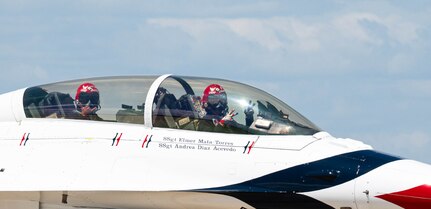 Pilot and passenger prepare for take off.