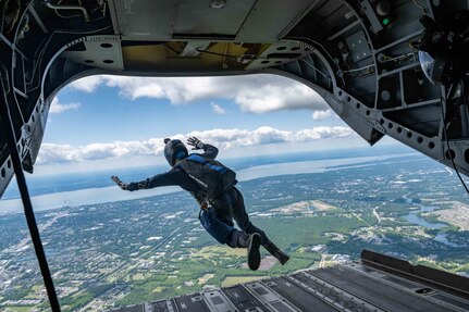 Person jumping out of a helicopter.