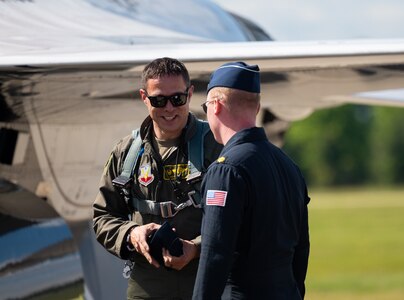 Aviators talk while on the flight line.