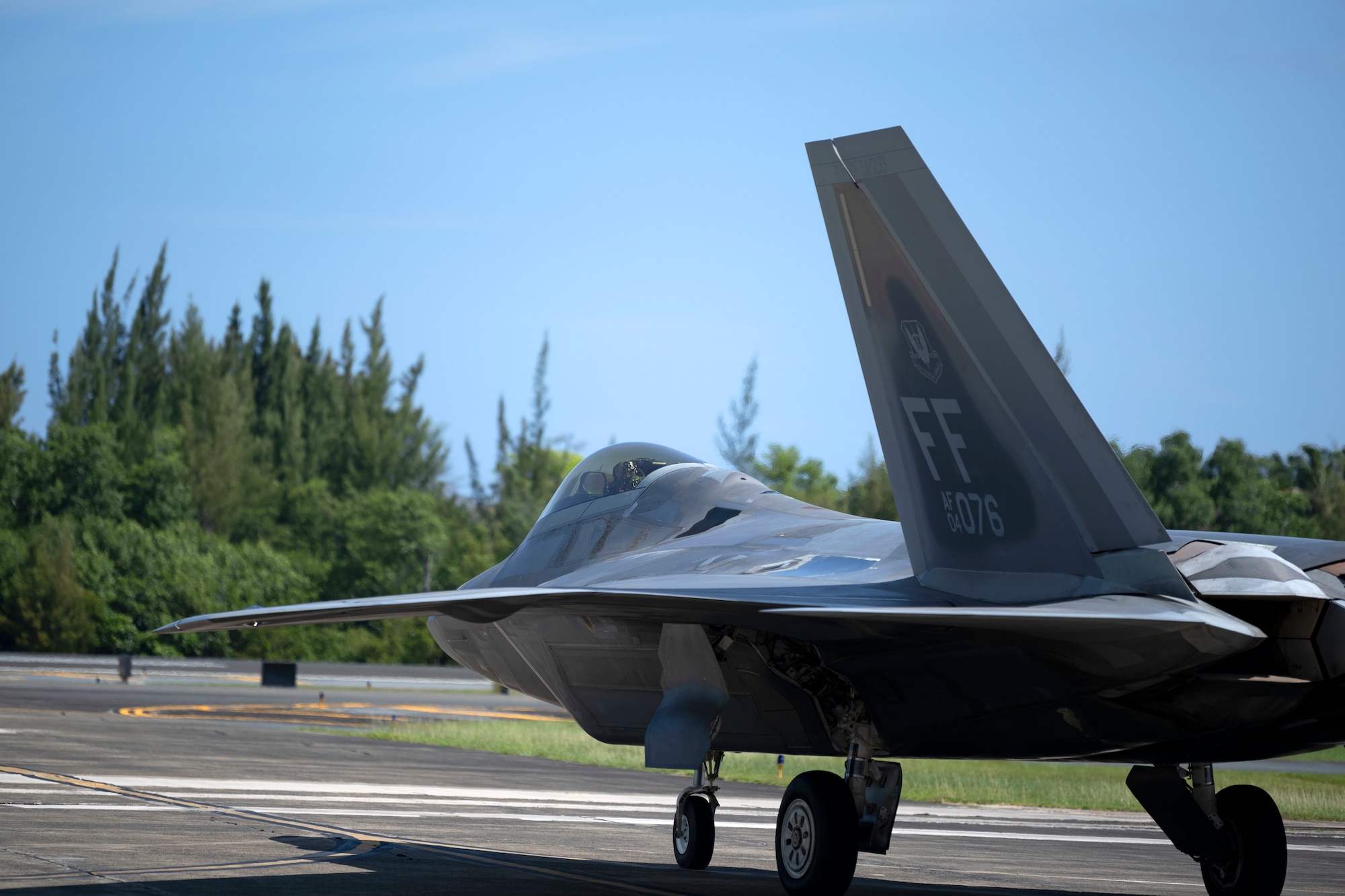 An F-22 Raptor assigned to the 192nd Wing, Virginia Air National Guard, departs the 156th Wing airfield during Operation Hoodoo Sea at Muñiz Air National Guard Base, Carolina, Puerto Rico, May 4, 2023. Operation Hoodoo Sea is a multi-unit training exercise where participant units conduct agile combat training in the coastal southeast of the U.S. to test agile communications innovations, portable aerospace ground equipment, aircraft concealment hangars and survival kits. (U.S. Air National Guard photo by Master Sgt. Rafael Rosa)