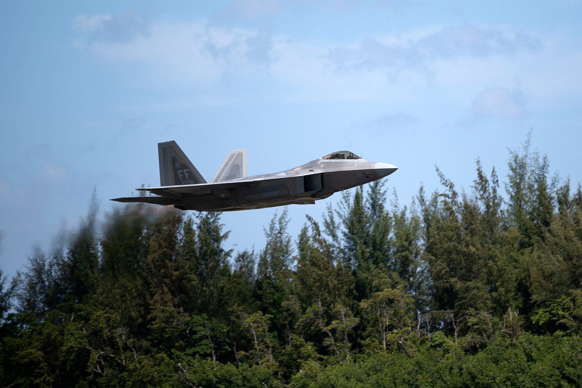 An F-22 Raptor assigned to the 192nd Wing, Virginia Air National Guard, departs the 156th Wing airfield during Operation Hoodoo Sea at Muñiz Air National Guard Base, Carolina, Puerto Rico, May 4, 2023. Operation Hoodoo Sea is a multi-unit training exercise where participant units conduct agile combat training in the coastal southeast of the U.S. to test agile communications innovations, portable aerospace ground equipment, aircraft concealment hangars and survival kits. (U.S. Air National Guard photo by Master Sgt. Rafael Rosa)
