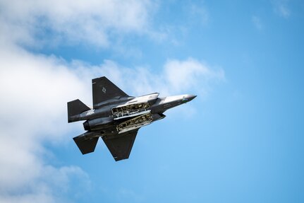 A jet fly's during an air show.