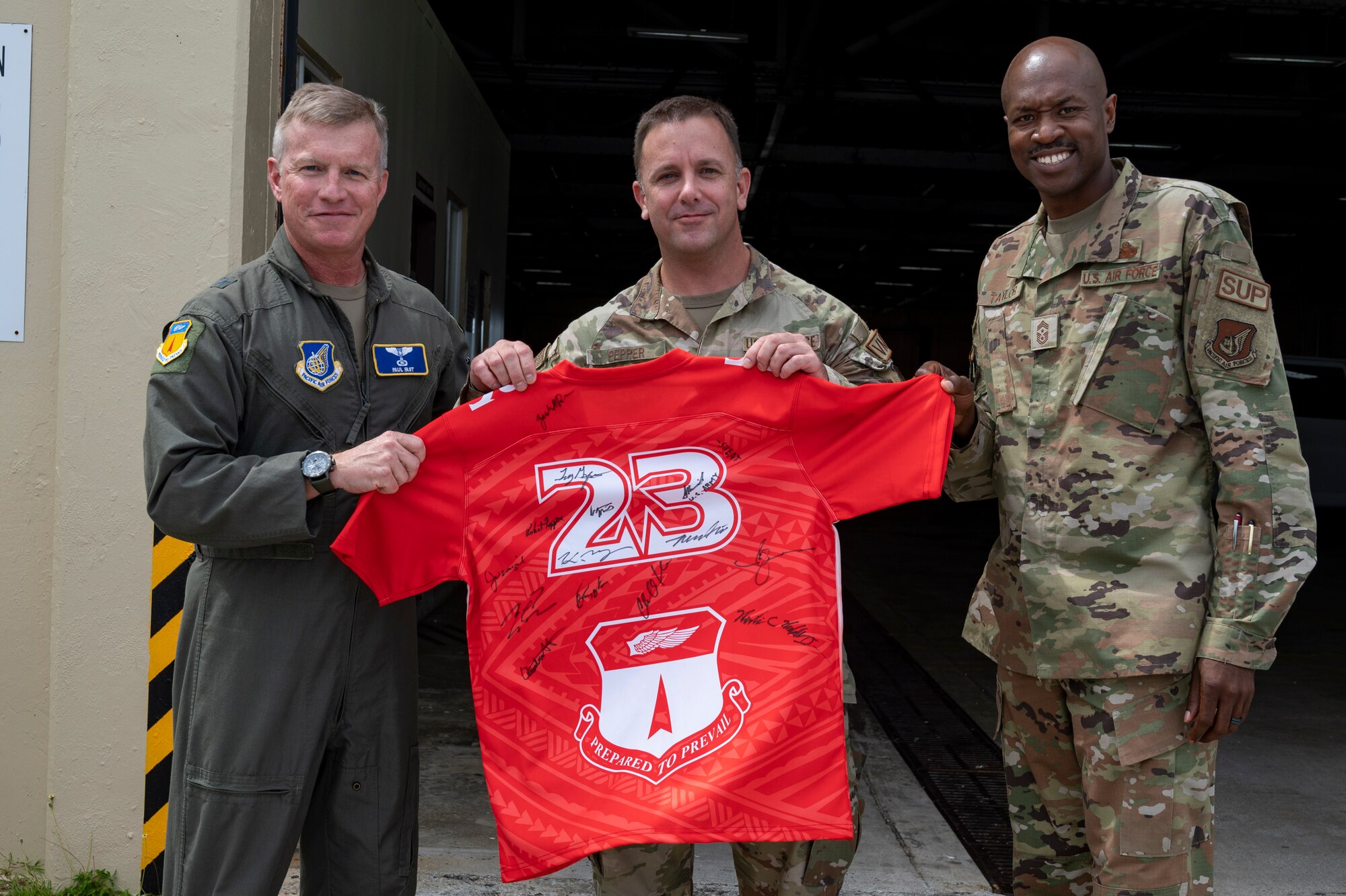 U.S. Air Force Tech. Sgt. Robert Pepper, the noncommissioned officer in charge of Silver Flag maintenance assigned to the 36th Logistics Readiness Squadron, receives the Linebacker of the Week Award from U.S. Air Force Brig. Gen. Paul Fast, commander of the 36th Wing, and U.S. Air Force Chief Master Sgt. Nicholas Taylor, the command chief of the 36th Wing, at Andersen Air Force Base, Guam, April 19, 2023. The Team Andersen Linebacker of the Week recognizes outstanding enlisted, officer, civilian and total force personnel who have had an impact on achieving Team Andersen’s mission, vision and priorities. (U.S. Air Force photo by Airman 1st Class Emily Saxton)