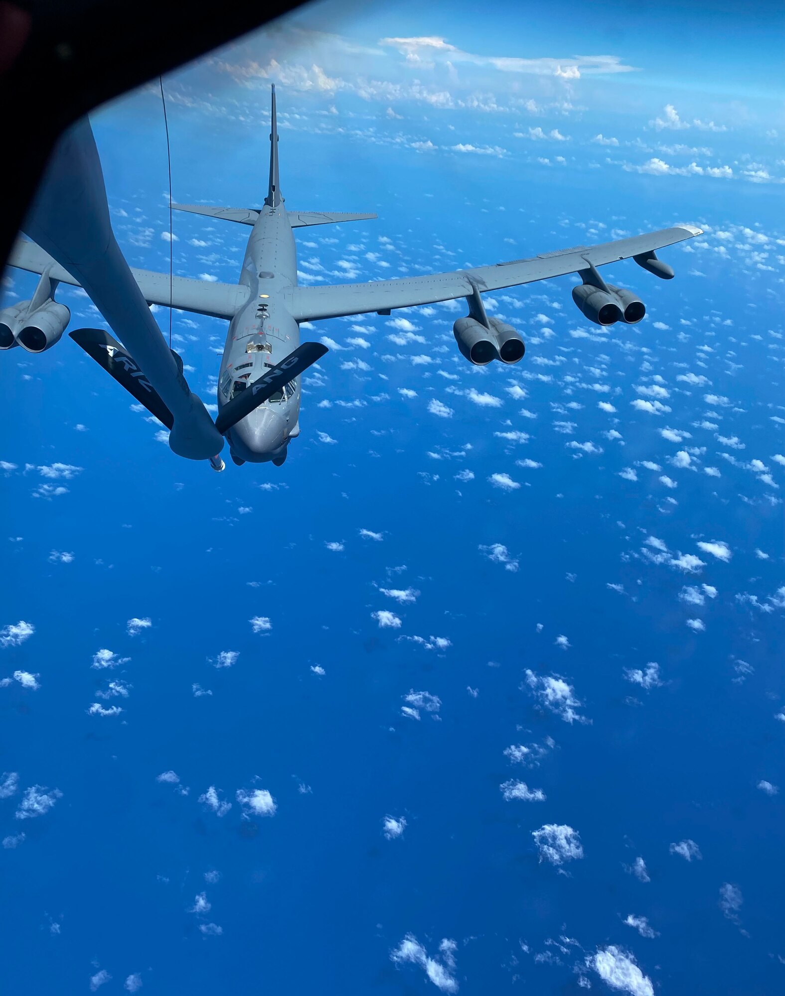 A U.S. Air Force B-52 Stratofortress assigned to the 2nd Bomb Wing, Barksdale Air Force Base, Louisiana, receives fuel from a U.S. Air Force KC-135 Stratotanker assigned to the 506th Expeditionary Air Refueling Squadron during a Bomber Task Force mission over the Philippine Sea, April 26, 2023. Air-to-air refueling capabilities are a key logistical enabler of U.S., allied, and partner nations’ aircraft, protecting prosperity, peace, and stability across the Pacific.A 161st Air Refueling Wing co-pilot assigned to the 506th Expeditionary Air Refueling Squadron flies a KC-135 Stratotanker from Andersen Air Force Base, Guam in preparation for a Bomber Task Force refueling mission over the Philippine Sea on April 26, 2023. Air-to-air refueling capabilities are a key logistical enabler of U.S., allied, and partner nations’ aircraft, protecting prosperity, peace, and stability across the Pacific. (U.S. Air Force Photo by Capt. Katie Mueller)