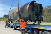 Belgian employees assigned to Army Field Support Battalion-Benelux at the Zutendaal Army Prepositioned Stocks-2 worksite load a muti-role bridge company bridge bay onto a commercial line haul transporter at the Zutendaal APS-2 site, May 4. The MRBC will be issued to the 50th Muti-Role Bridge Company at an Equipment Configuration and Hand-off Area on Mihail Kogalniceau Air Base, Romania, next week during DEFENDER 23.