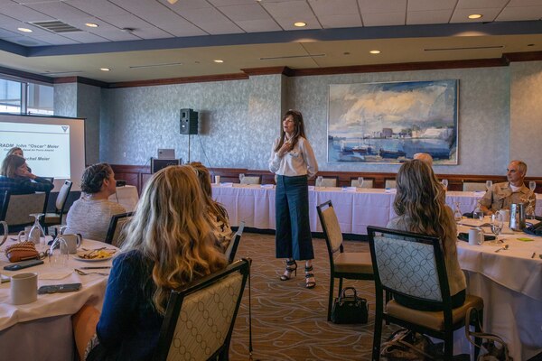 Rachel Meier speaks standing up in front of a crowd