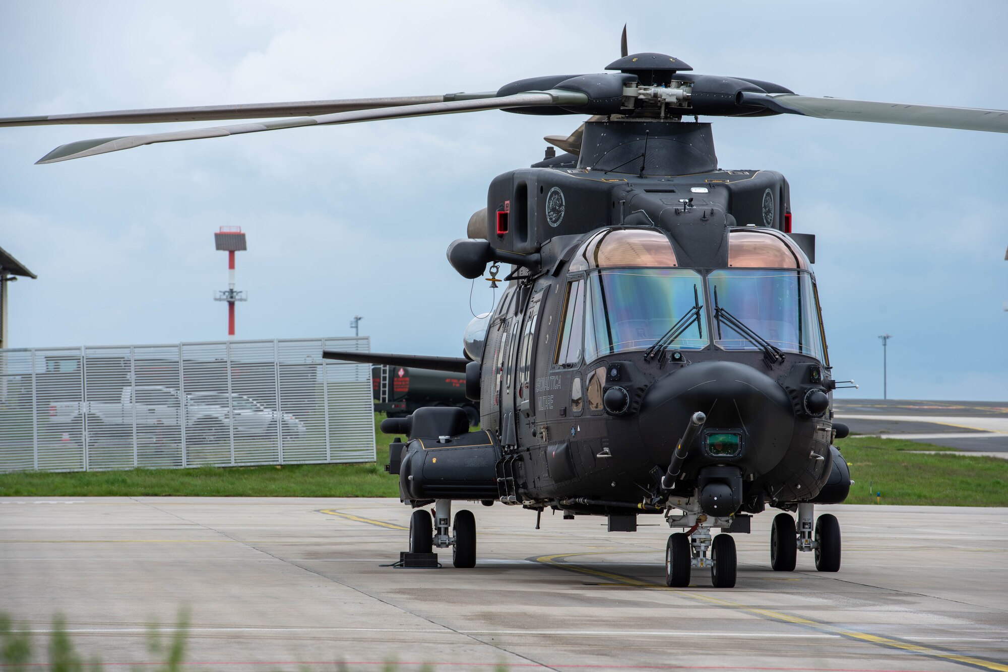 A helicopter awaits a preflight check.