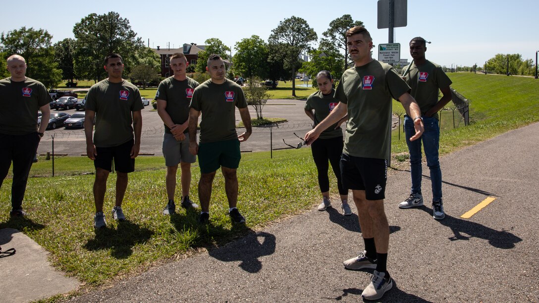 U.S. Marine Corps Cpl. Wolfgang Lynn, president of the Marine Forces Reserve Single Marine Program, addresses his fellow Marines during a levee clean-up volunteer activity in New Orleans, April 27, 2023. One of the goals of the SMP is to encourage Marines to be more active in their communities. (U.S. Marine Corps photo by Pfc. Nicholas Bryan)