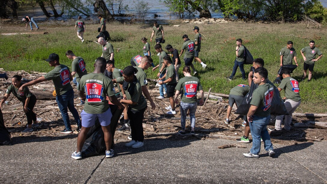 U.S. Marines with Marine Forces Reserve conduct a levee clean-up volunteer activity under the direction of members of the Single Marine Program in New Orleans, April 27, 2023. One of the goals of the SMP is to encourage Marines to be more active in their community. (U.S. Marine Corps photo by Pfc. Nicholas Bryan)