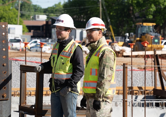 Capt. Vihn Dao, who is serving as a Construction Control Representative for the Louisville District, has a discussion with contractor Tre Baker on the site of the Louisville VA Medical Center project May 3.