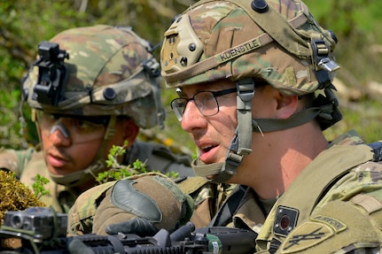 Spc. Joseph Kuenstle, a civil affairs sergeant with C Co/418th Civil Affairs Battalion, and 1st Lt. Luis Irizarry, an engineer officer with the 8th Brigade Engineer Battalion, 2nd Armored Brigade Combat Team, 1st Cavalry Division, scan the area for enemy elements during Exercise Combined Resolve 18 here on May 5, 2023. Combined Resolve 18 provides opportunities for integrated, total force training with the U.S. Army, U.S. Army Reserve, and U.S. Army National Guard. It demonstrates how the U.S. Army stays ready to respond to any crisis anywhere in the world.