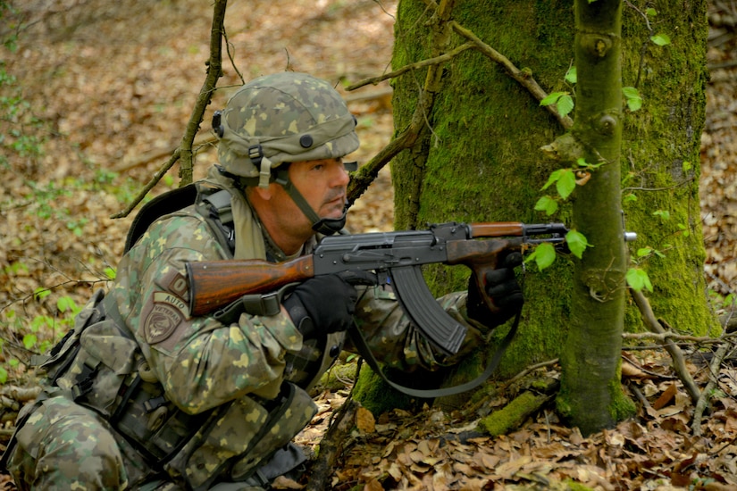 Master Sgt. Petre Ionita, a Civil-Military Cooperation (CIMIC) non-commissioned officer with the 1st CIMIC, Romanian Land Forces, moves into a firing position during Exercise Combined Resolve 18 here on May 5, 2023. Conducting world-class training events such as Combined Resolve 18 allows exercise participants the opportunity to train alongside Allied and partner nations in a dynamic and realistic training environment provided by the Joint Multinational Readiness Center.