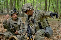 1st Sgt. Kevin Morgan, the senior-most noncommissioned officer of C Co/418th Civil Affairs Battalion, and Cpt. Kyle, Byron, the Higher Headquarters Commander with the 8th Brigade Engineer Battalion, 2nd Armored Brigade Combat Team, 1st Cavalry Division, coordinate troop movement during Exercise Combined Resolve 18 here on May 5, 2023. Combined Resolve 18 provides opportunities for integrated, total force training with the U.S. Army, U.S. Army Reserve, and U.S. Army National Guard. The exercise demonstrates how the U.S. Army stays ready to respond to any crisis anywhere in the world.