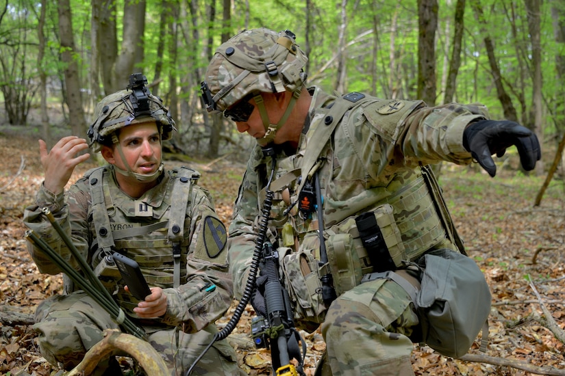 1st Sgt. Kevin Morgan, the senior-most noncommissioned officer of C Co/418th Civil Affairs Battalion, and Cpt. Kyle, Byron, the Higher Headquarters Commander with the 8th Brigade Engineer Battalion, 2nd Armored Brigade Combat Team, 1st Cavalry Division, coordinate troop movement during Exercise Combined Resolve 18 here on May 5, 2023. Combined Resolve 18 provides opportunities for integrated, total force training with the U.S. Army, U.S. Army Reserve, and U.S. Army National Guard. The exercise demonstrates how the U.S. Army stays ready to respond to any crisis anywhere in the world.