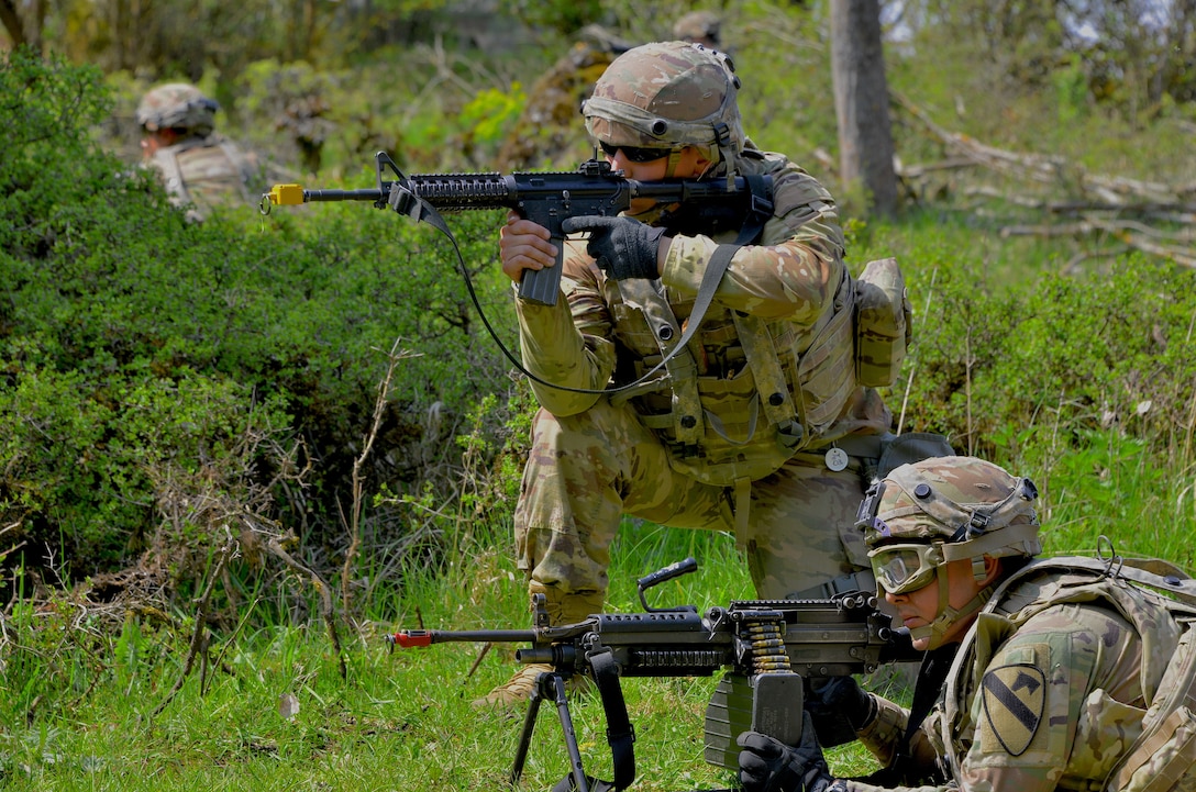 Soldiers assigned to the 8th Brigade Engineer Battalion, 2nd Armored Brigade Combat Team, 1st Cavalry Division, take up firing positions during Exercise Combined Resolve 18 here on May 5, 2023. Combined Resolve 18 allows exercise participants the opportunity to train alongside Allied and partner nations in a dynamic and realistic training environment provided by the Joint Multinational Readiness Center.