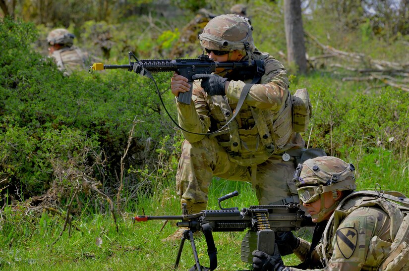 Soldiers assigned to the 8th Brigade Engineer Battalion, 2nd Armored Brigade Combat Team, 1st Cavalry Division, take up firing positions during Exercise Combined Resolve 18 here on May 5, 2023. Combined Resolve 18 allows exercise participants the opportunity to train alongside Allied and partner nations in a dynamic and realistic training environment provided by the Joint Multinational Readiness Center.