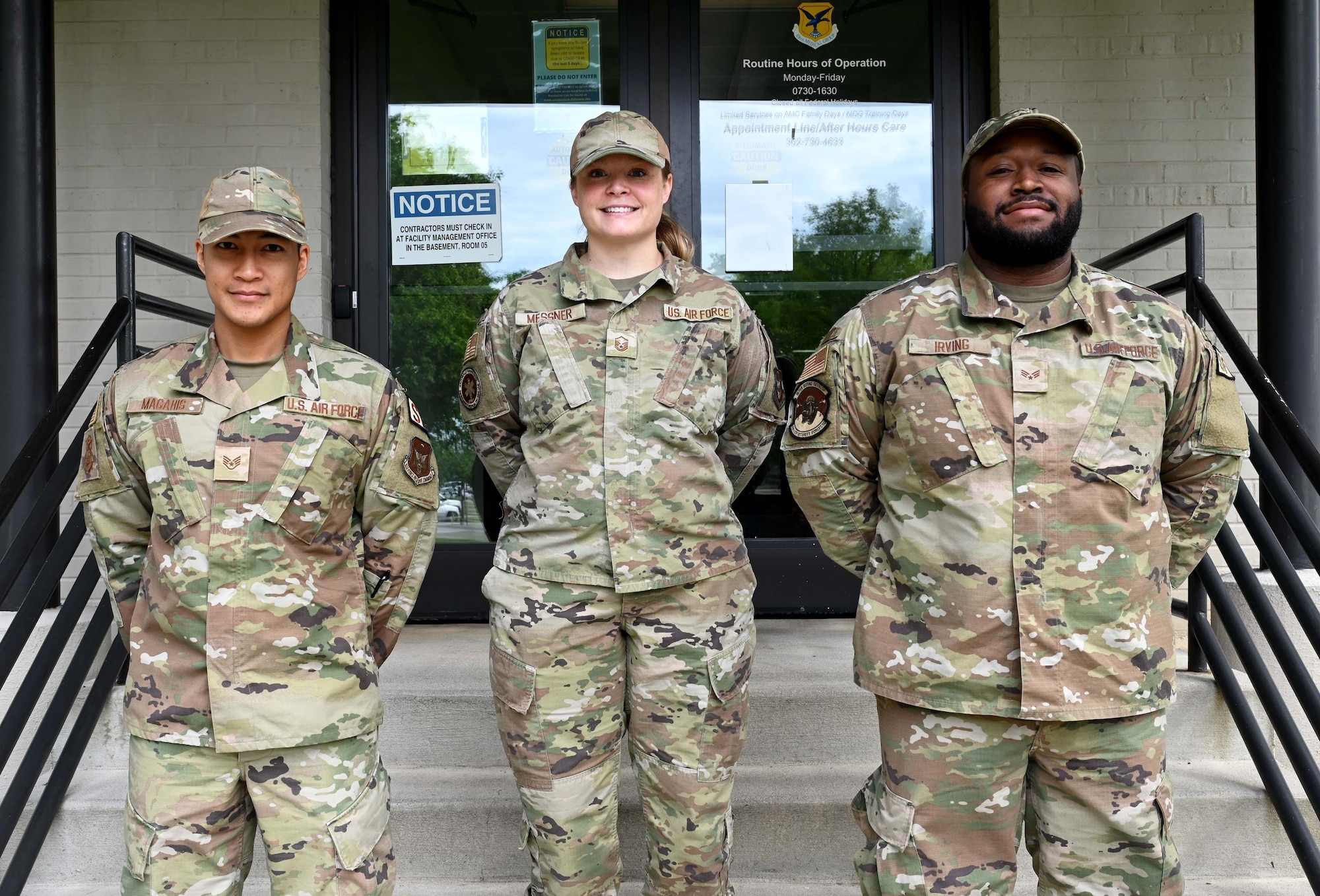 Master Sgt. Lindsey Messner, 512th Aerospace Medicine Squadron physical exams manager, stands with Staff Sgt. Geyo Magahis and Senior Airman Nasseer Irving, both 512th Security Forces Squadron, during their medical appointments May 5, 2023, at Dover Air Force Base, Delaware.