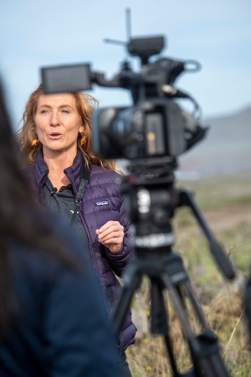 Wildlife biologist Melissa Booker, in charge of terrestrial wildlife and seabirds for Naval Base Coronado, speaks with press during a media embark aboard San Clemente Island, Jan. 12, 2023.