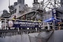 Firefighters from the San Francisco Fire Department (SFFD) board the Ticonderoga-class guided-missile cruiser USS Princeton (CG 59) in preparation for an integrated firefighting drill as a part of the San Francisco Fleet Week (SFFW) 2022, Oct. 4, 2022.