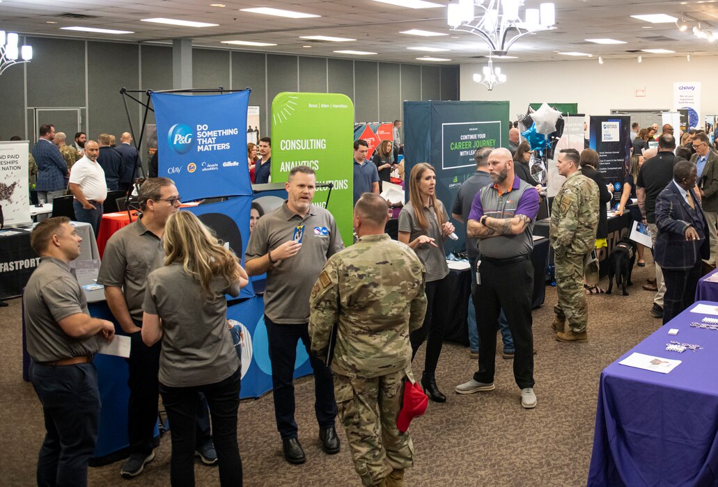 Company recruiters and job hunters talk during Hiring Our Heroes job fair April 27, 2023, at the Hope Hotel & Richard C. Holbrooke Conference Center, Wright-Patterson Air Force Base, Ohio. The U.S. Chamber of Commerce Foundation’s annual hiring event helps transitioning service members, veterans and military spouses find employment. (U.S. Air Force photo by Airman 1st Class Elizabeth Figueroa)