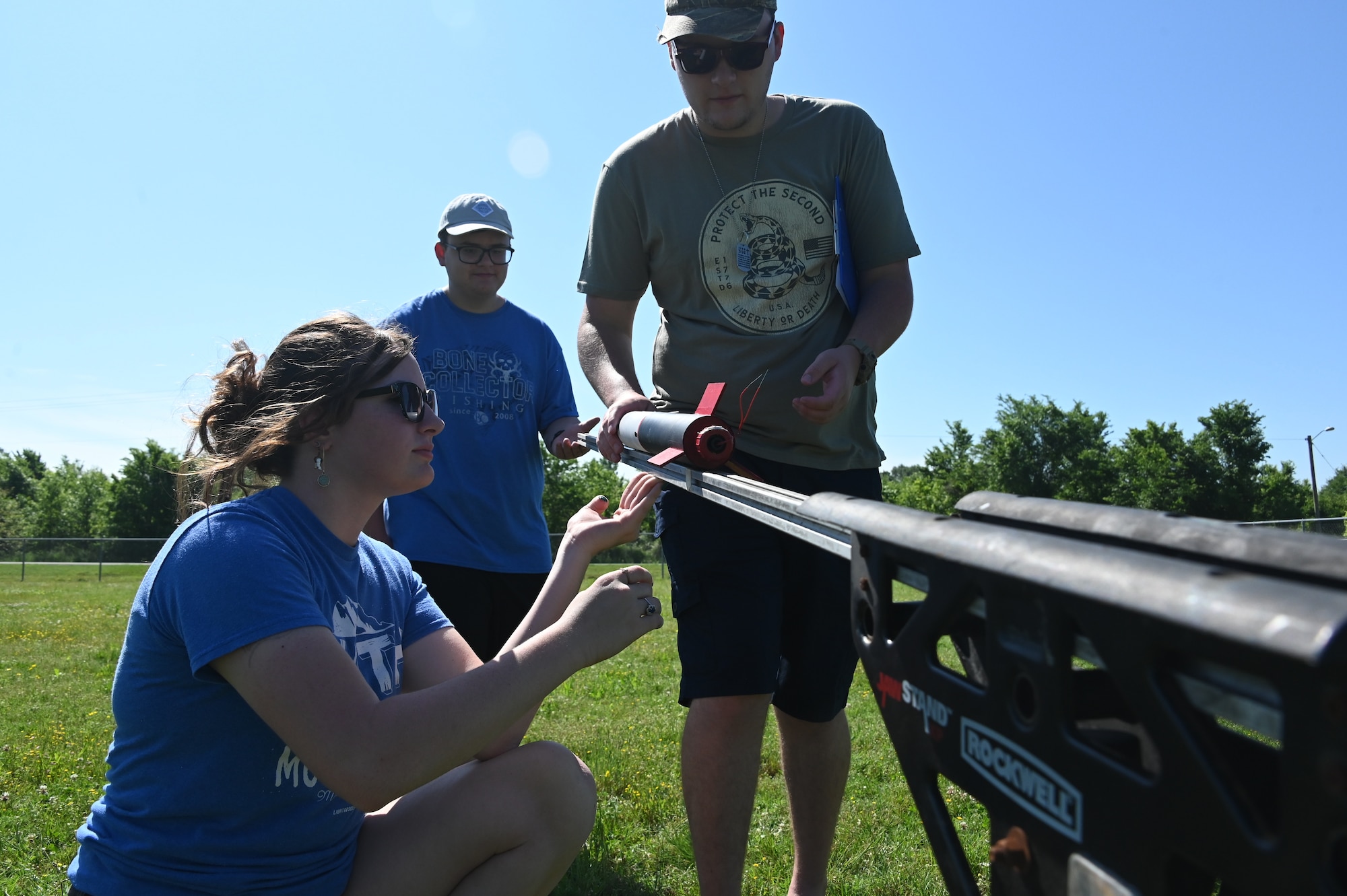 Haughton High School Junior ROTC team members, secure a rocket on the launch pad at South Bossier Park in Bossier City, Louisiana, May 6, 2023