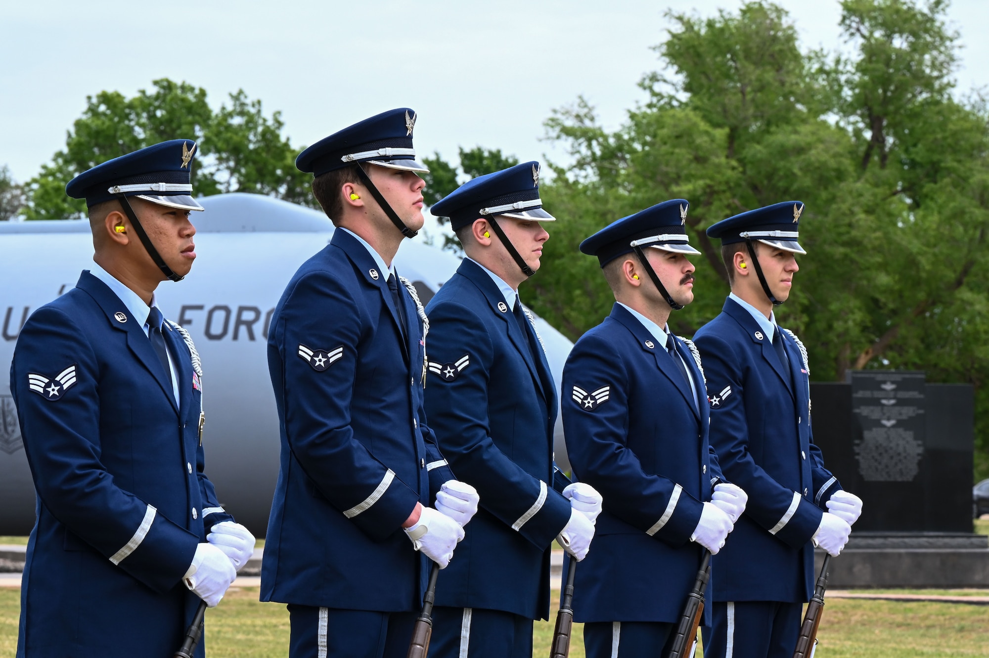 The Blue Knights Honor Guard stands at a resting position during the Shell 77 memorial at Altus Air Force Base, Oklahoma, May 3, 2023. The Honor Guard fired their rifles during the playing of “Taps” at the memorial. (U.S. Air Force photo by Airman 1st Class Heidi Bucins)
