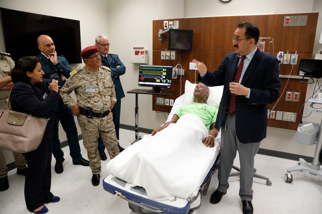 Luis E. Llerena, MD, the Medical Director of University of South Florida (USF) HEALTH shows attendees to U.S. Central Command’s 2023 Medical Security Cooperation Exchange (MSCE) a medical simulation room during a tour of USF’s Center for Advanced Medical Learning and Simulation (CAMLS), May 1, 2023.  The MSCE brings together medical professionals from the U.S. and partner nations to share best practices and strengthen relationships. (U.S. Central Command Public Affairs photo by Tom Gagnier)