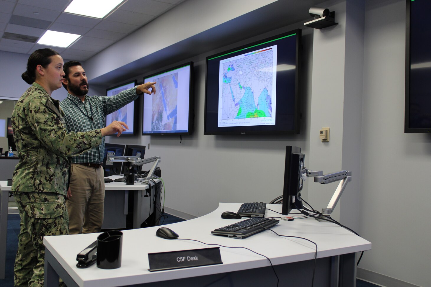 Civilian Michael Bourgeois, Naval Oceanography, CENTCOM 5th Fleet Representative and Meteorology and Oceanography Officer LTJG Keely V. Martin, 5th Fleet Desk at Naval Oceanography’s Maritime Operations Center, discuss the 5th Fleet AOR while observing topographic images of its geographical area. 

Recently, the U.S. Naval Meteorology and Oceanography Command (Naval Oceanography) proved mission-essential in the first U.S.-led evacuation of hundreds of American citizens from the, currently war-torn, country of Sudan.

Naval Oceanography provided critical forecasts and surveys of ports, harbors and coastal areas navigated by U.S. Navy ships during [non-combative] evacuation procedures from a port city in Sudan.