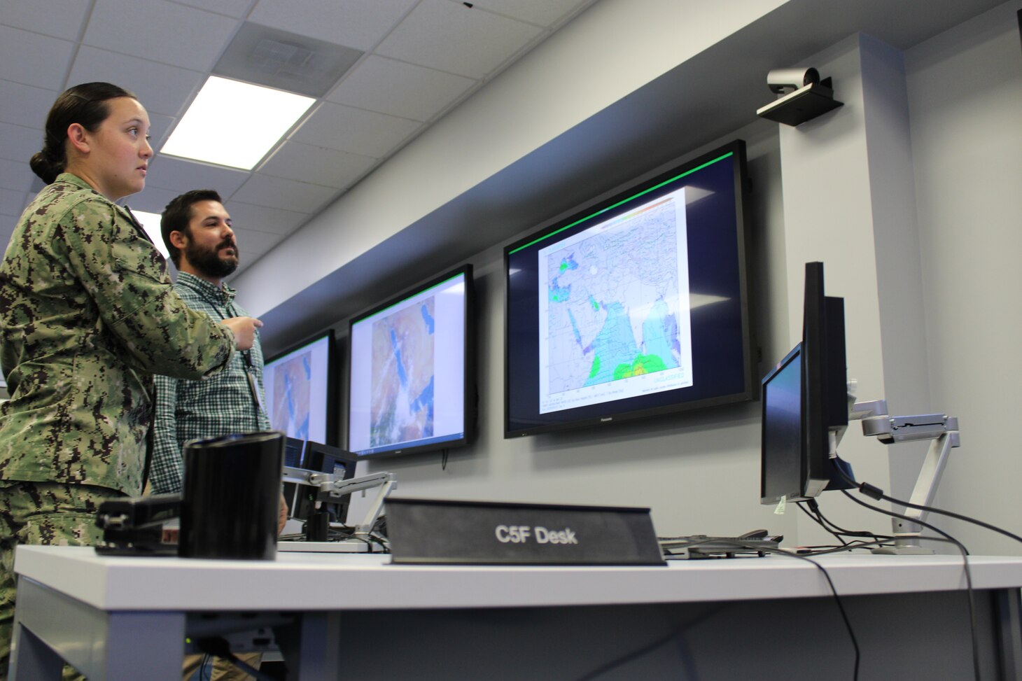 Civilian Michael Bourgeois, Naval Oceanography, CENTCOM 5th Fleet Representative and Meteorology and Oceanography Officer LTJG Keely V. Martin, 5th Fleet Desk at Naval Oceanography’s Maritime Operations Center, discuss the 5th Fleet AOR while observing topographic images of its geographical area. 

Recently, the U.S. Naval Meteorology and Oceanography Command (Naval Oceanography) proved mission-essential in the first U.S.-led evacuation of hundreds of American citizens from the, currently war-torn, country of Sudan.

Naval Oceanography provided critical forecasts and surveys of ports, harbors and coastal areas navigated by U.S. Navy ships during [non-combative] evacuation procedures from a port city in Sudan.