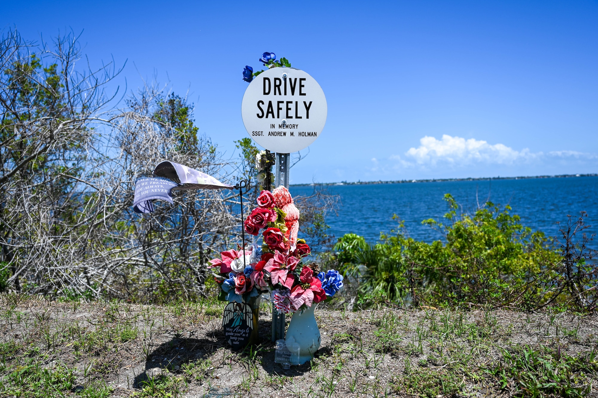 Memorial Marker for Staff Sgt. Andrew Holman, 45th LRS air traffic controller April 21, 2023 in Melbourne, Fla., Memorial Markers are signs posted at sites of incidents to remind others to drive safely. (U.S. Space Force photo by Senior Airman Samuel Becker)