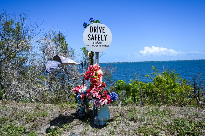Memorial Marker for Staff Sgt. Andrew Holman, 45th LRS air traffic controller April 21, 2023 in Melbourne, Fla., Memorial Markers are signs posted at sites of incidents to remind others to drive safely. (U.S. Space Force photo by Senior Airman Samuel Becker)