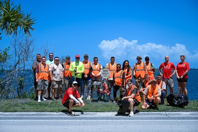 Members of the 45th LRS pose for group photo on April 21, 2023 in Melbourne, Fla. 45th LRS adopted the section of highway that Staff Sgt. Andrew Holman 45th LRS air traffic controller had passed away on. (U.S. Space Force photo by Senior Airman Samuel Becker)