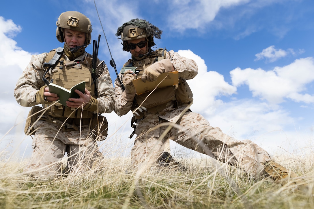 U.S. Marine Capt. Joseph Terstenyak, a Fire Support Coordinator with 3rd Light Armored Reconnaissance Battalion, 1st Marine Division, and Capt. Cody Iszler, a Forward Air Controller with 3rd Battalion, 1st Marine Regiment, 1st MARDIV, coordinate close-air support from the AW-1Z Cobra and the UH-1Y Venom during exercise Garnet Rattler on Saylor Creek Range in Grasmere, Idaho, April 18, 2023. Garnet Rattler is a joint exercise between Marines and airmen to train Joint Terminal Attack Controllers to be more efficient and lethal in a realistic training environment. Terstenyak is a native of Old Bridge, New Jersey.