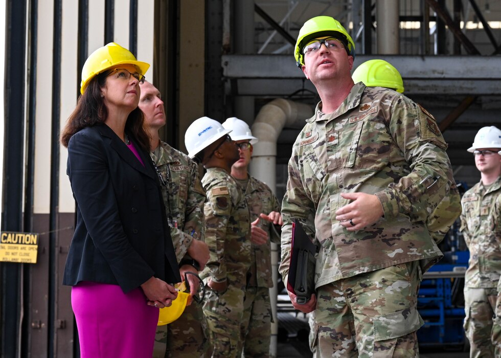 Maj. Jonathan Schmidt, 15th Maintenance Squadron commander, and Kristyn Jones, assistant secretary of the Air Force for Financial Management and Comptroller, performing the duties of under secretary of the Air Force, look at damage caused by a recent storm during her visit to to Joint Base Pearl Harbor-Hickam, Hawaii, May 2, 2023. Schmidt and Jones viewed Hickam’s aircraft maintenance complex and spoke about challenges incurred due to the environment and inclement weather. (U.S. Air Force photo by Senior Airman Zoie Cox)