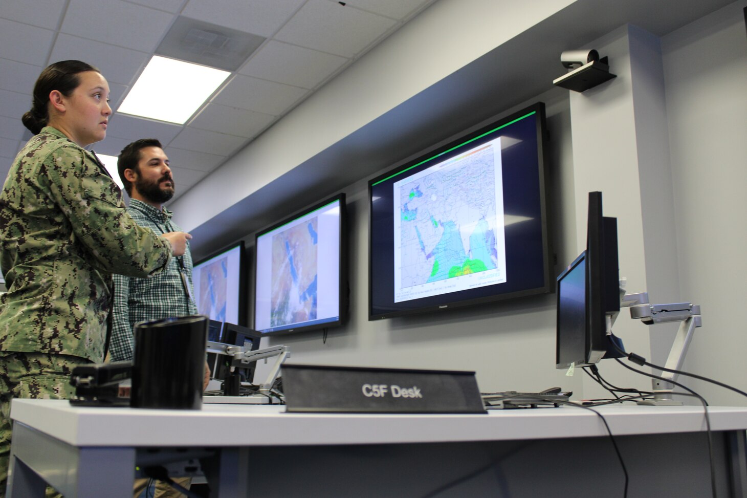 Civilian Michael Bourgeois, Naval Oceanography, CENTCOM 5th Fleet Representative and Meteorology and Oceanography Officer LTJG Keely V. Martin, 5th Fleet Desk at Naval Oceanography’s Maritime Operations Center, discuss the 5th Fleet AOR while observing topographic images of its geographical area. 

Recently, the U.S. Naval Meteorology and Oceanography Command (Naval Oceanography) proved mission-essential in the first U.S.-led evacuation of hundreds of American citizens from the, currently war-torn, country of Sudan.

Naval Oceanography provided critical forecasts and surveys of ports, harbors and coastal areas navigated by U.S. Navy ships during [non-combative] evacuation procedures from a port city in Sudan.