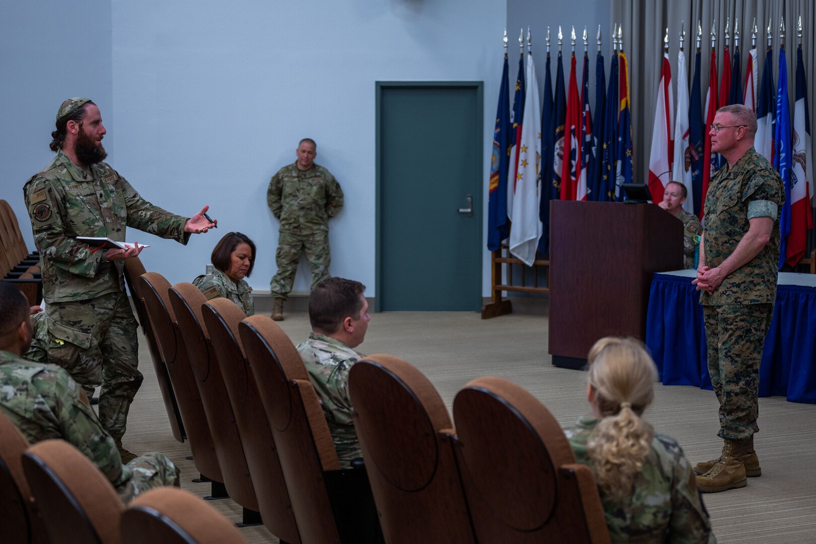 U.S. Air Force Lt. Col. Jack Barnett, 9th Combat Operations Squadron (9 COS) chief, left, asks a question to U.S. Marine Corps Master Gunnery Sgt. Scott H. Stalker, U.S. Space Command command senior enlisted leader, at Space Delta ‘s auditorium on Vandenberg Space Force Base, Calif., May 6, 2023. Stalker opened the floor up for a Q &A portion after his brief to 9 COS members. The 9 COS is an Air Force Reserve Command space operations unit and is the Reserve Associate unit to Space Delta 5, which augments intelligence, planning and operations at the Combined Space Operations Center. (U.S. Space Force photo by Tech. Sgt. Luke Kitterman)