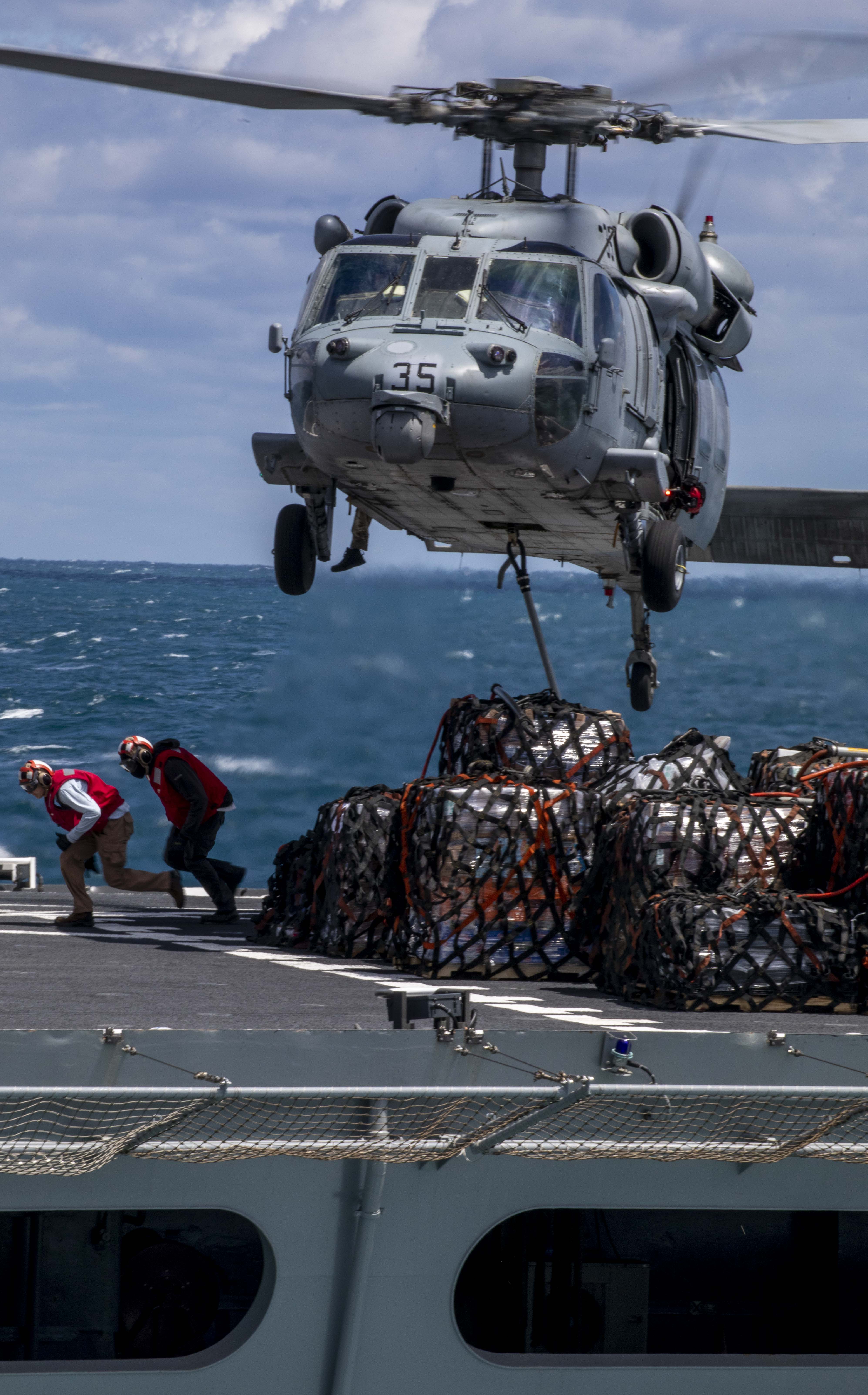 USNS Supply (T-AOE-6) replenishes USS Wasp (LHD 1).