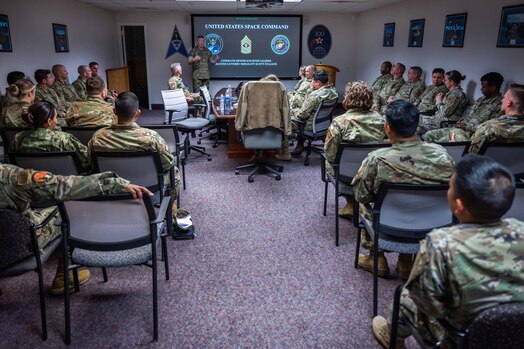  U.S. Marine Corps Master Gunnery Sgt. Scott H. Stalker, U.S. Space Command (USPACECOM) command senior enlisted leader, gives a USSPACECOM mission brief to 148th Space Operations Squadron members at the Vandenberg Tracking Station on Vandenberg Space Force Base, Calif., May 6, 2023. The 148 SOPS is an Air National Guard satellite control unit which operates the Air Force’s MILSATCOM systems providing the warfighter with communication capabilities. In time of emergency, by order of the Governor of California, the 148 SOPS can also provide military support to civil authorities to the California Joint Force Headquarters Operations Center (Command and Control) and Joint Incident Site Communications Capability for cyberspace. (U.S. Space Force photo by Tech. Sgt. Luke Kitterman)