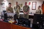 U.S. Marine Corps Master Gunnery Sgt. Scott H. Stalker, U.S. Space Command (USPACECOM) command senior enlisted leader, second from right, and gets an overview of the MILSATCOM mission the 148th Space Operations Squadron (148 SOPS) provides to the warfighter at the Vandenberg Tracking Station on Vandenberg Space Force Base, Calif., May 6, 2023. In time of emergency, by order of the Governor of California, the 148 SOPS can also provide military support to civil authorities to the California Joint Force Headquarters Operations Center (Command and Control) and Joint Incident Site Communications Capability for cyberspace. (U.S. Space Force photo by Tech. Sgt. Luke Kitterman)