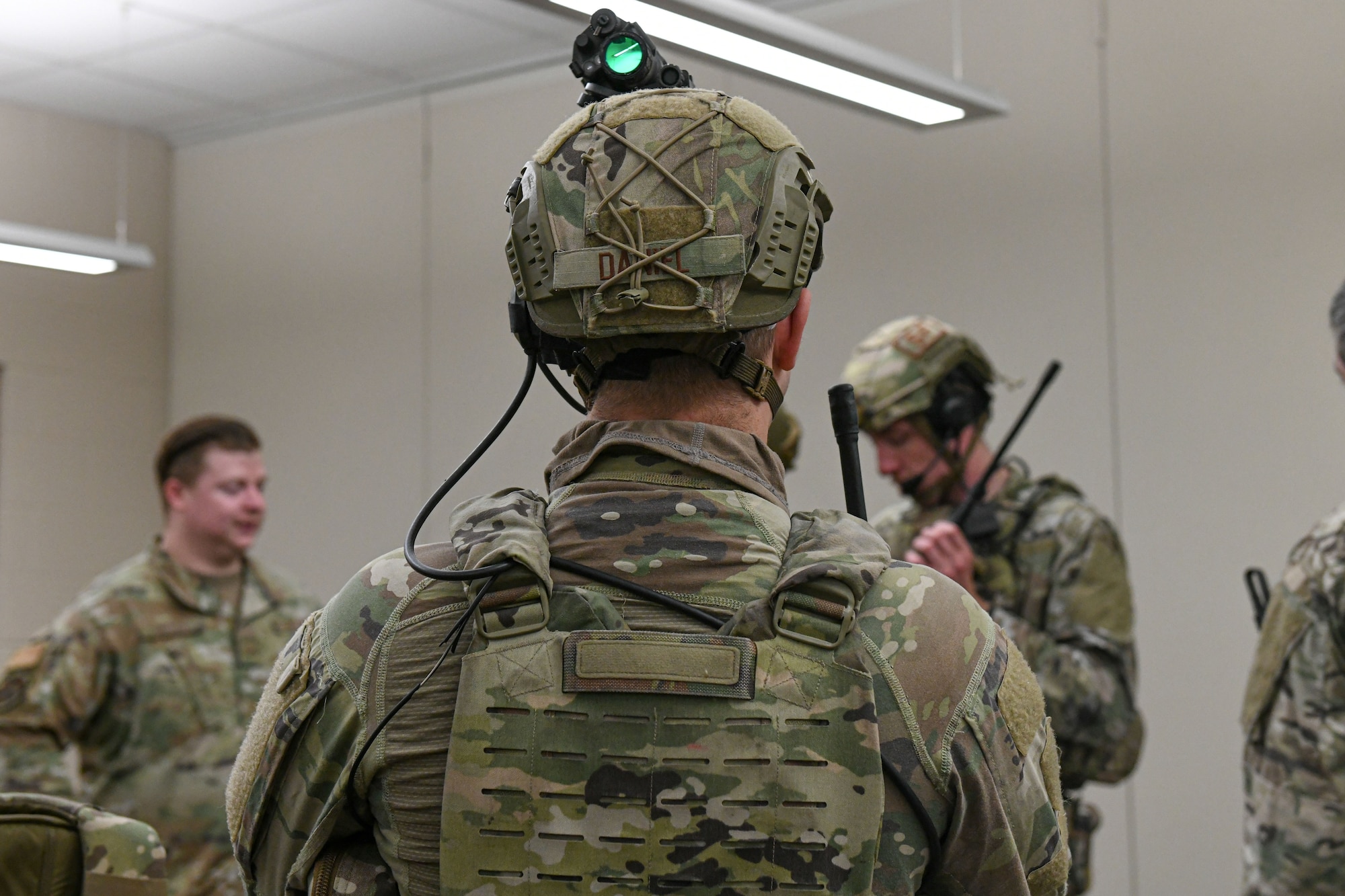 man in uniform prepares his equipment