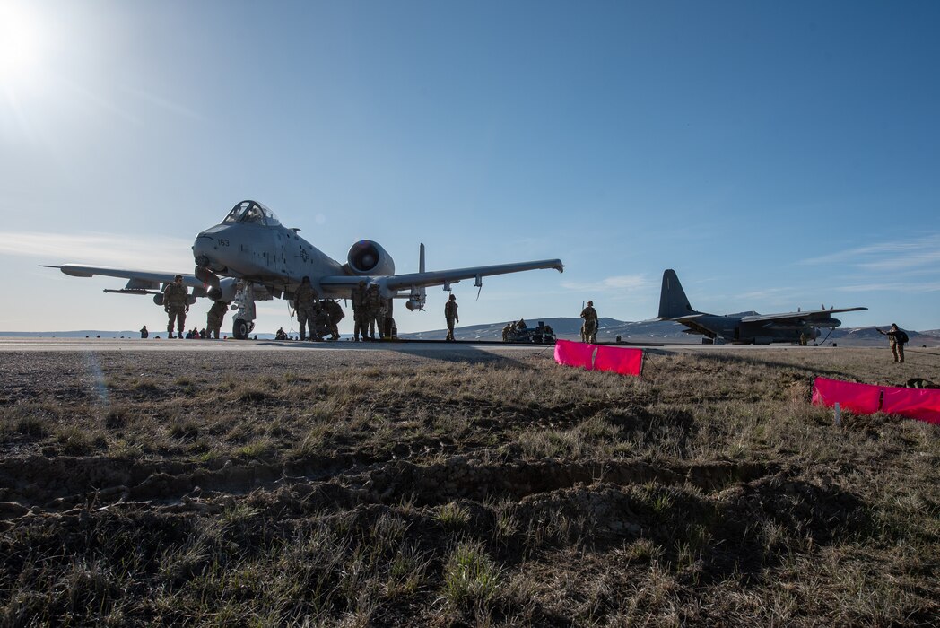 An MC-130J Commando II offloads fuel to an A-10 Thunderbolt II on Highway 287 in Wyoming during Exercise Agile Chariot on April 30, 2023, honing capabilities linked to Agile Combat Employment. Instead of relying on large, fixed bases and infrastructure, ACE employs smaller, more dispersed locations and teams to rapidly move aircraft, pilots and other personnel as needed. Under ACE, millions of miles of public roads can serve as functional runways with Forward Arming and Refueling Points when necessary. (U.S. Air National Guard photo by Master Sgt. Phil Speck)